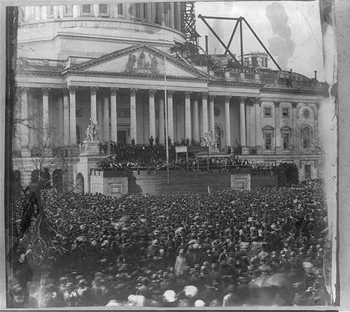 The crowd gathers at the U.S. Capitol for Abraham Lincoln to deliver his First Inaugural Address from beneath the canopy in t