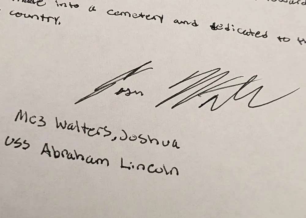 Detail from a handwritten essay showing the writer's signature and name
