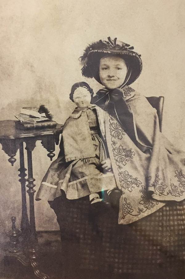 Mary Baker (future Mary Patteson) posing with a doll.