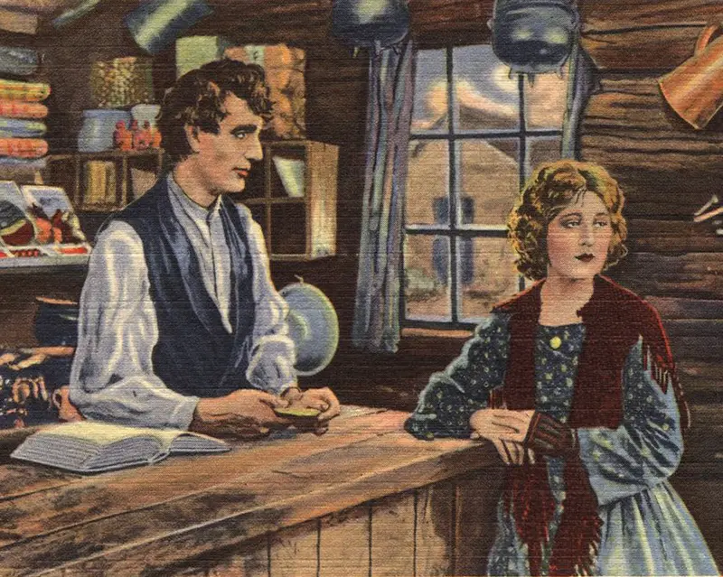 A brightly colored postcard painting of Abraham Lincoln standing behind a store counter talking to Ann Rutledge.