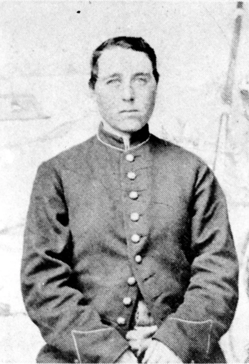 A grainy, black-and-white photo of Alber Cashier in a Civil War military uniform.